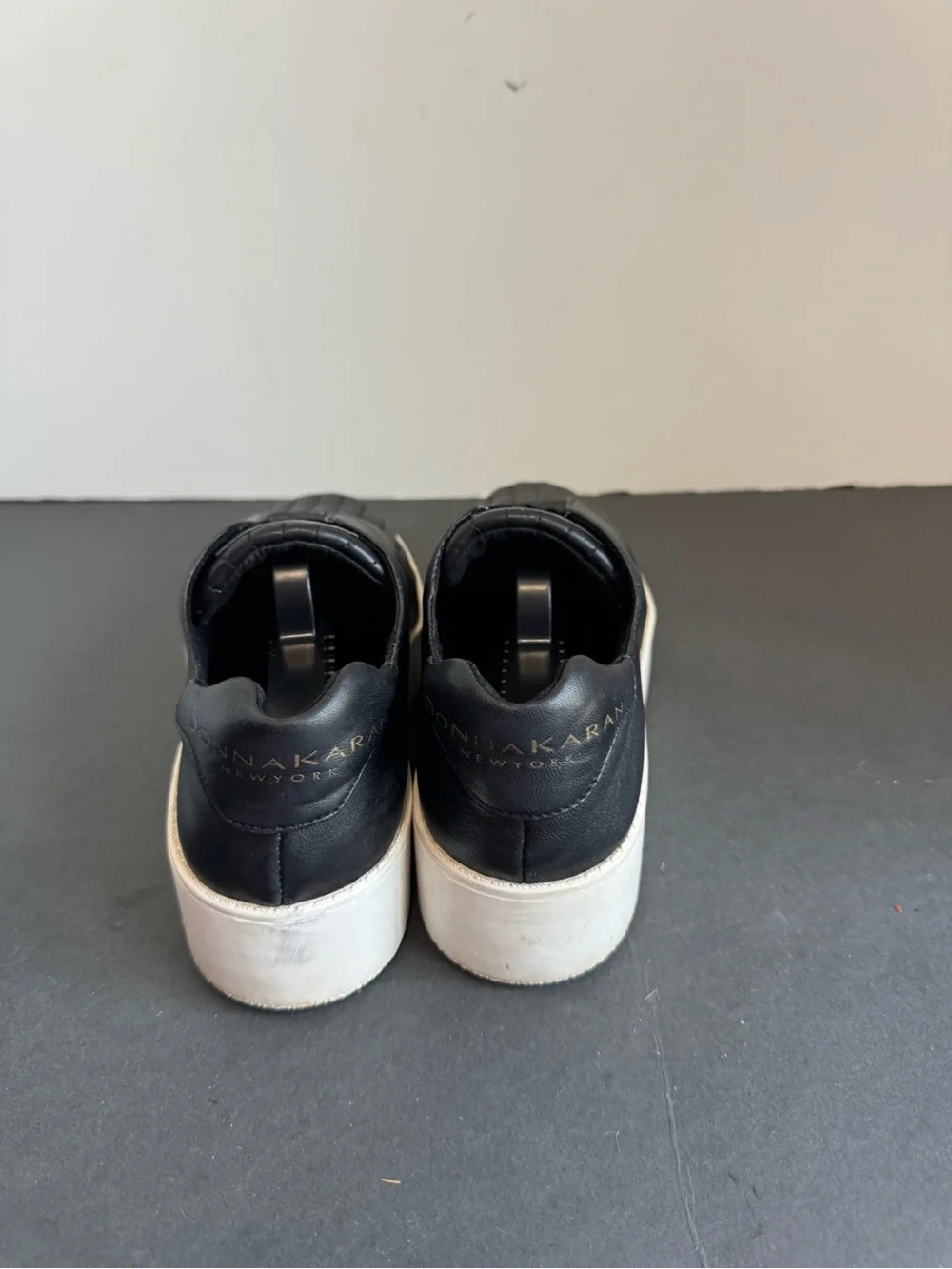 Donna Karan New York black leather slip-on sneakers. Size 6
